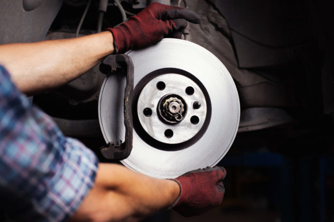 Car,Mechanic,Repairing,Brakes,On,Car.,He,Is,Changing,Brake Brake Pad Repair