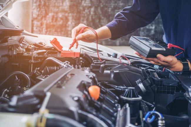 Hands,Of,Car,Mechanic,Working,In,Auto,Repair,Service. Car battery replacement