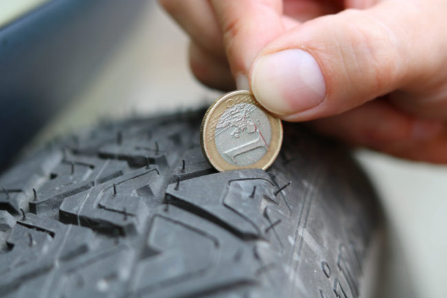Mature,Profile,Control,With,Money check tyre depth with coin